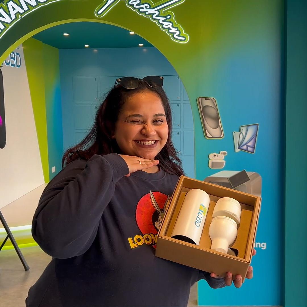 People playing a multi-level interactive financial literacy game at a brand activation event in Dubai, learning how to save and invest money.